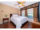 Cozy bedroom with wood floors and large windows at 5409 Napoli Cv, Lake Mary, FL 32746