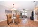 Bright dining room with glass-top table and four wicker chairs at 5409 Napoli Cv, Lake Mary, FL 32746