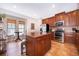 Modern kitchen with stainless steel appliances and an island at 5409 Napoli Cv, Lake Mary, FL 32746