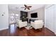 Living room with hardwood floors, a wet bar, and comfortable seating at 5409 Napoli Cv, Lake Mary, FL 32746