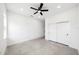 Bright bedroom features neutral tile flooring, recessed lights, a ceiling fan, and a double door closet at 5544 Sw 136Th Ave, Ocala, FL 34481