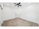 Bedroom with a ceiling fan, and neutral-toned floor tiling at 5544 Sw 136Th Ave, Ocala, FL 34481