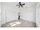 Bright bedroom with a ceiling fan, closet, and window at 5544 Sw 136Th Ave, Ocala, FL 34481