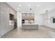 Modern kitchen featuring sleek cabinets, a center island, and stainless steel appliances at 5544 Sw 136Th Ave, Ocala, FL 34481