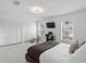 Spare bedroom featuring tile flooring, updated fixtures, a large window, and closet space at 564 Shadow Glenn Pl, Winter Springs, FL 32708