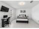 Spare bedroom featuring tile flooring, updated fixtures, a large window, and desk space at 564 Shadow Glenn Pl, Winter Springs, FL 32708