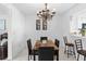Dining room with marble table and decorative lighting, perfect for Gathering gatherings at 564 Shadow Glenn Pl, Winter Springs, FL 32708