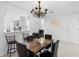 A view of the open-concept dining room showcasing modern lighting and barstool seating at counter at 564 Shadow Glenn Pl, Winter Springs, FL 32708