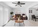 Bright living room with a ceiling fan, decorative rug, and leather sofa set at 564 Shadow Glenn Pl, Winter Springs, FL 32708