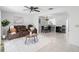Bright living room showcasing tile floors and seamlessly blending into the dining area at 564 Shadow Glenn Pl, Winter Springs, FL 32708