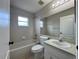 Clean bathroom with a bathtub, toilet, and vanity at 594 Terranova Cir, Winter Haven, FL 33884