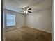 Bedroom with carpeted floor and ceiling fan at 594 Terranova Cir, Winter Haven, FL 33884