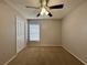 Bedroom with carpeted floor and ceiling fan at 594 Terranova Cir, Winter Haven, FL 33884