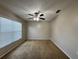 Bedroom with carpeted floor and ceiling fan at 594 Terranova Cir, Winter Haven, FL 33884