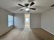 Main bedroom with ceiling fan and ensuite bathroom at 594 Terranova Cir, Winter Haven, FL 33884