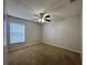 Bedroom with carpeted floor and ceiling fan at 594 Terranova Cir, Winter Haven, FL 33884