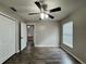 Bright bedroom featuring wood-look floors and an open view at 594 Terranova Cir, Winter Haven, FL 33884