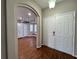 Entryway with view into kitchen and living areas at 594 Terranova Cir, Winter Haven, FL 33884