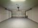 Spacious garage with automatic door opener at 594 Terranova Cir, Winter Haven, FL 33884