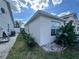 Side view of the house showcasing landscaping and exterior finishes at 594 Terranova Cir, Winter Haven, FL 33884