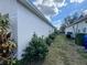 View of the house's side, showing well-maintained landscaping and exterior at 594 Terranova Cir, Winter Haven, FL 33884