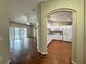 Kitchen with white cabinets and wood-look flooring at 594 Terranova Cir, Winter Haven, FL 33884