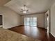 Living room with sliding glass doors to patio at 594 Terranova Cir, Winter Haven, FL 33884