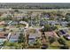 Aerial shot of a property featuring a screened pool and fenced yard nestled in a suburban neighborhood near the highway at 616 Mellowood Ave, Orlando, FL 32825