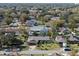 An aerial view of a neighborhood showing single Gathering homes with mature trees and green lawns at 616 Mellowood Ave, Orlando, FL 32825