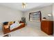 Neutral bedroom with a futon, tile flooring, and natural lighting at 616 Mellowood Ave, Orlando, FL 32825