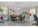 Stylish dining room featuring modern light fixture, table with seating, and tiled floors at 616 Mellowood Ave, Orlando, FL 32825