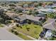 A well manicured lawn with small palm trees adorn the front of this single Gathering home at 616 Mellowood Ave, Orlando, FL 32825