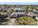 A well manicured front yard with small palm trees surrounds the single Gathering home at 616 Mellowood Ave, Orlando, FL 32825