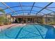 The backyard has a beautiful in-ground pool surrounded by a screened enclosure at 616 Mellowood Ave, Orlando, FL 32825