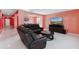 Comfortable living room with tv, and a view to the dining room at 741 Gila Dr, Kissimmee, FL 34759