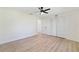 Bright bedroom with closet, new flooring, and neutral walls at 8546 Amber Oak Dr, Orlando, FL 32817