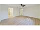 Bright bedroom with wood-look floors and access to bathroom at 8546 Amber Oak Dr, Orlando, FL 32817