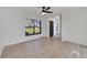 Inviting living room with natural light, a ceiling fan, and wood-look flooring at 8546 Amber Oak Dr, Orlando, FL 32817