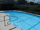 Beautiful pool featuring clear water and a convenient safety rail at 8546 Amber Oak Dr, Orlando, FL 32817