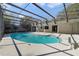 Refreshing screened pool with patio at 8546 Amber Oak Dr, Orlando, FL 32817