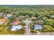 Aerial view showcasing a residential area with well-maintained lawns, mature trees, and beautiful homes, perfect for families at 8585 Cypress Ridge Ct, Sanford, FL 32771