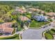 Stunning aerial view showcases the perfectly landscaped front yard and circular drive of this charming suburban home at 8585 Cypress Ridge Ct, Sanford, FL 32771