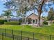 Large backyard features a screened porch, lush lawn, privacy hedges, and a cozy fire pit, offering a private outdoor retreat at 8585 Cypress Ridge Ct, Sanford, FL 32771