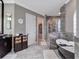 Spacious bathroom features a dual vanity with dark wood cabinets, a soaking tub, and a frameless glass shower at 8585 Cypress Ridge Ct, Sanford, FL 32771