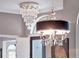 Stylish chandeliers in the dining room offering views of the entry at 8585 Cypress Ridge Ct, Sanford, FL 32771