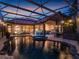 View of the pool area with outdoor seating, a bar, and a view of the home's architecture at 8585 Cypress Ridge Ct, Sanford, FL 32771