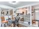 Dining area with a glass table and chairs near the kitchen at 970 E Michigan St # B, Orlando, FL 32806