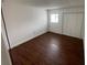 Bedroom featuring hardwood floors and ample closet space at 116 Scottsdale Sq # 2, Winter Park, FL 32792