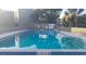 Community pool with clear blue water at 116 Scottsdale Sq # 2, Winter Park, FL 32792