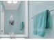 Bathroom featuring a large mirror, a sink, and a towel bar with fresh towels at 1220 Villa Ln # 135, Apopka, FL 32712